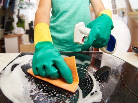 Local team cleaning a hard floor in a Swiss Cottage flat or office